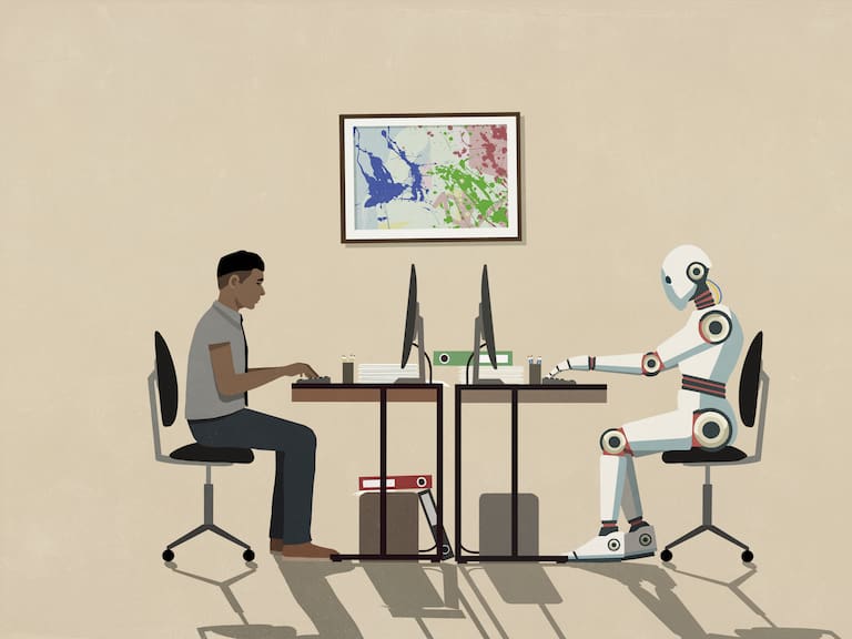 Man and humanoid robot working face to face at computers