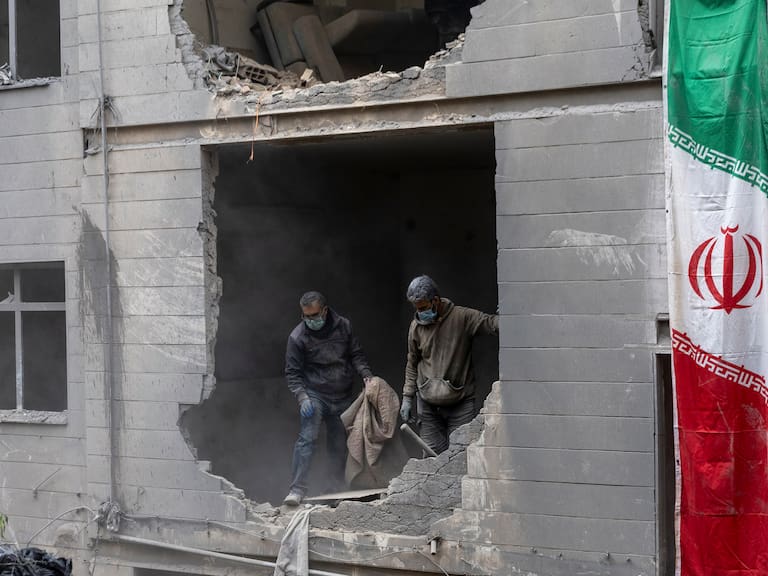 TEHRAN, IRAN - MARCH 15: People clear rubble in a house in the Beryanak District after it was damaged by missile attacks two days before, on March 15, 2026 in Tehran, Iran. The United States and Israel continued their joint attack on Iran that began on February 28. Iran retaliated by firing waves of missiles and drones at Israel, and targeting U.S. allies in the region. (Photo by Majid Saeedi/Getty Images)