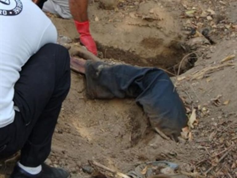 Aumenta a 21 los cuerpos encontrados en fosas clandestinas en la Barca Jalisco