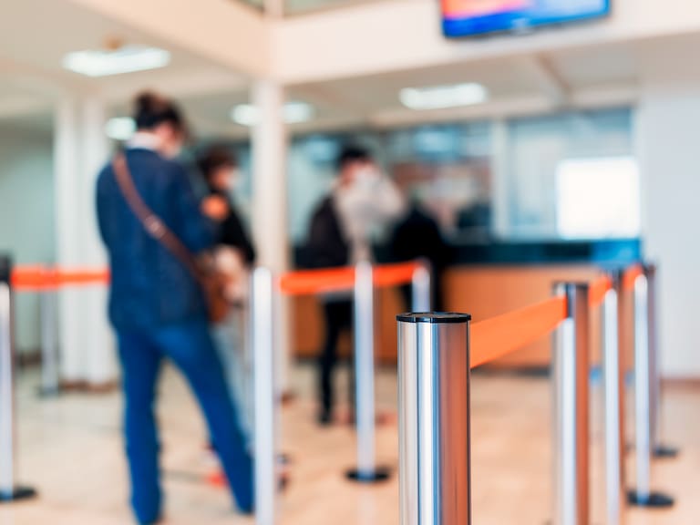row of people to the bank teller cashier defocused background
