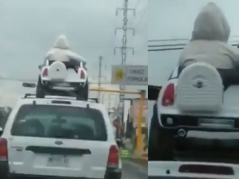 Captan a dos niños viajar en el toldo de una camioneta mientras llovía