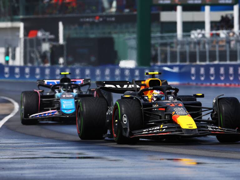 MONTREAL, QUEBEC - JUNE 09: Sergio Perez of Mexico driving the (11) Oracle Red Bull Racing RB20 leads Pierre Gasly of France driving the (10) Alpine F1 A524 Renault on track during the F1 Grand Prix of Canada at Circuit Gilles Villeneuve on June 09, 2024 in Montreal, Quebec. (Photo by Mark Thompson/Getty Images)